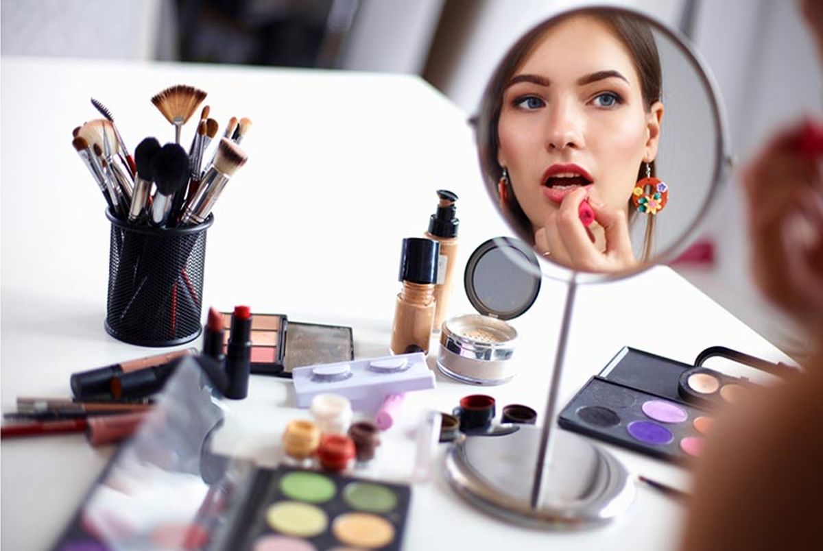 Woman applying face makeup